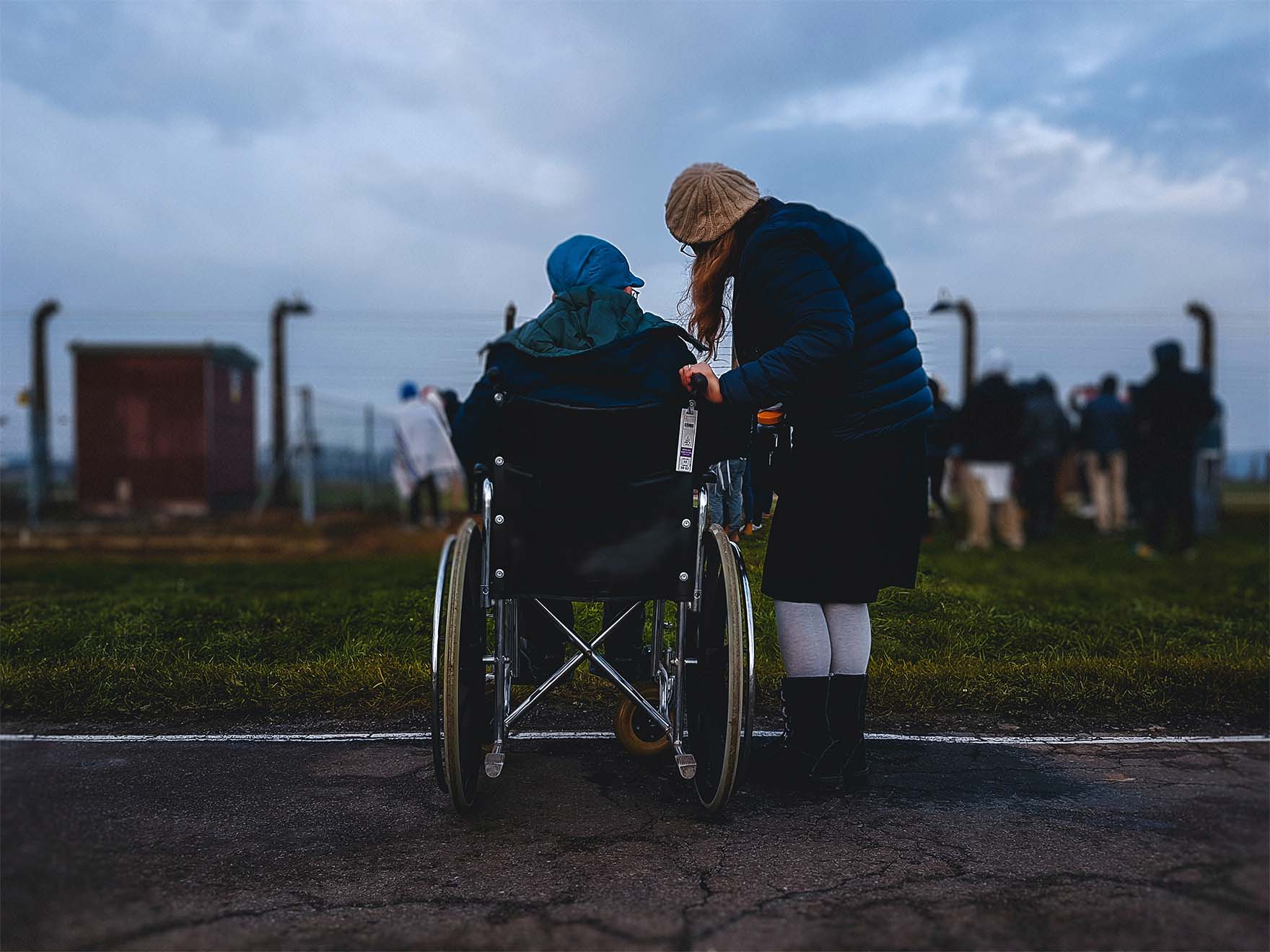 resident in a wheelchair with their carer