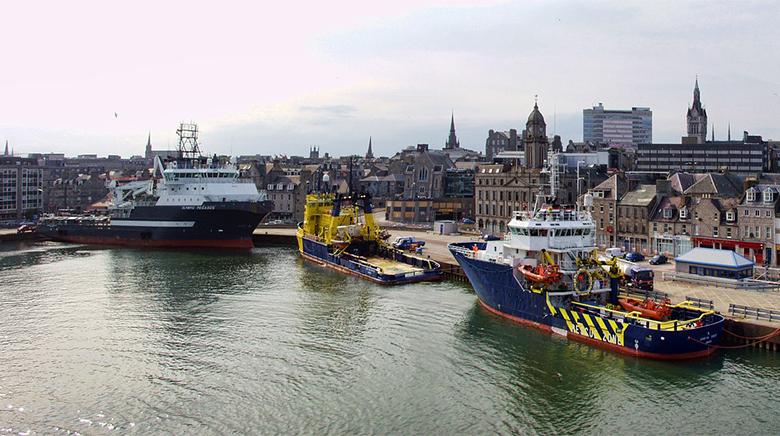 boats docked up in water in glasgow