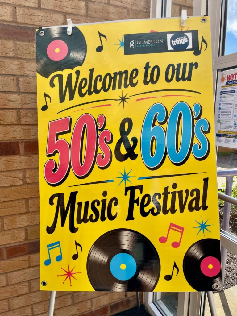 poster saying "welcome to our 50s &amp; 60s music festival"