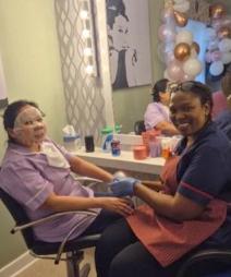carer with facemask in salon